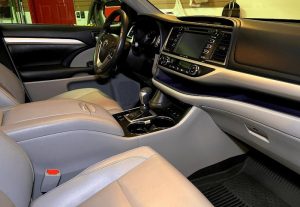 2021 Toyota Highlander interior after professional detailing, including deep upholstery cleaning, leather conditioning, dashboard and console restoration, and a spotless finish for a like-new look and feel