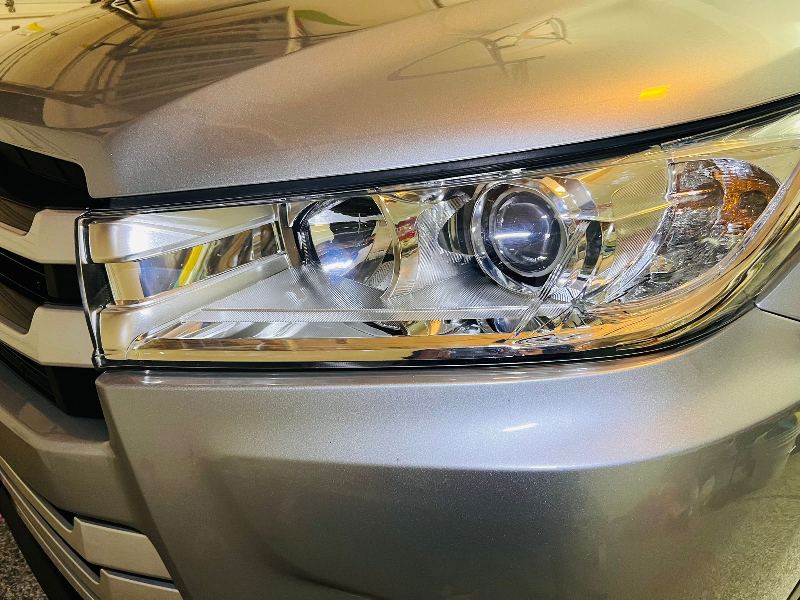 Restored 2021 Toyota Highlander headlight with professional polishing and ceramic coating applied for enhanced clarity, protection, and long-lasting shine