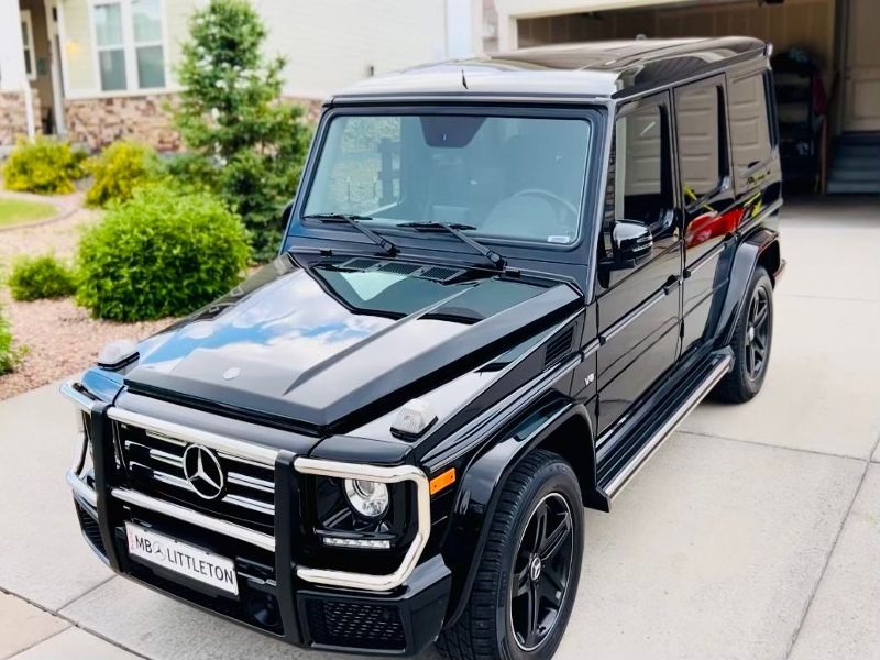 Black G-Wagon after 4-step paint correction and a 5-year ceramic coating, delivering a flawless, glossy finish with enhanced protection against scratches, water spots, and UV damage for long-lasting shine