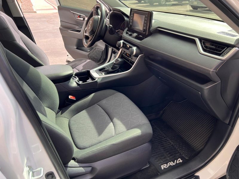 After detailing: Interior of the RAV4 fully restored, with clean seats, spotless floor mats, and a polished dashboard, showcasing a fresh, like-new appearance with a thorough, professional clean