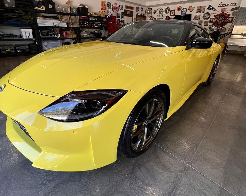 Yellow Nissan Z after the best detailing in Colorado, featuring a pristine, high-gloss finish with expert paint correction, polishing, and ceramic coating for superior protection against scratches, water spots, and contaminants, delivering a showroom-quality shine
