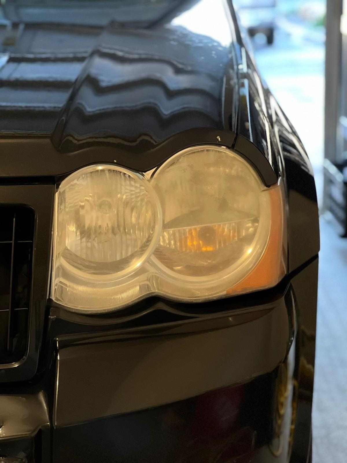 Before restoration: Foggy headlight with haziness, oxidation, and cloudiness, in need of professional restoration to restore clarity and improve lighting performance for a clear, like-new look