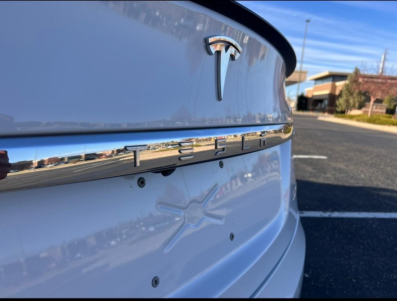 Luxury Tesla Model S after full exterior restoration and protection, featuring meticulous paint correction, scratch removal, and a premium ceramic coating for enhanced durability, UV protection, and a sleek, glossy finish that lasts