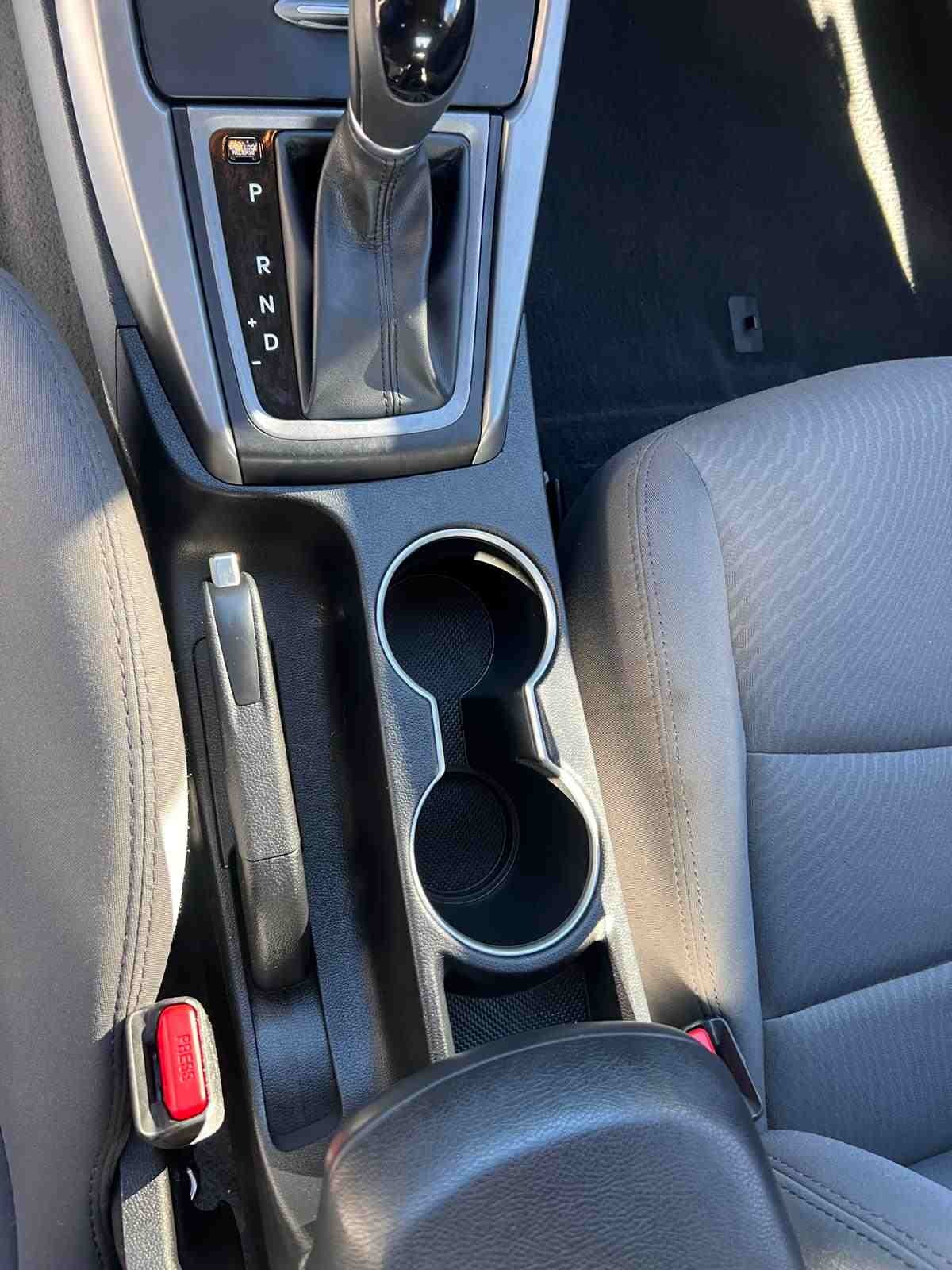 After detailing: Interior center console restored to a pristine, like-new condition, with all surfaces cleaned, polished, and conditioned for a smooth, fresh appearance free from stains and buildup